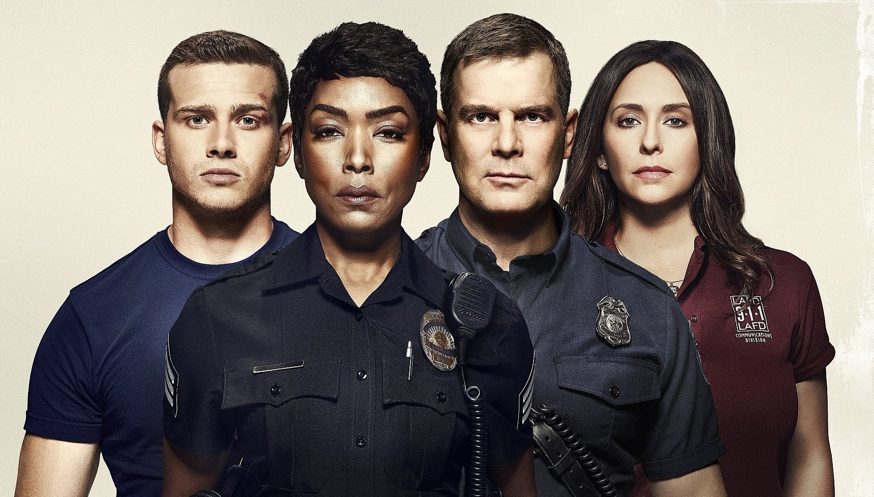 Oliver Stark, Angela Basett, Peter Krause, and Jennifer Love Hewitt standing together on the poster for 9-1-1
