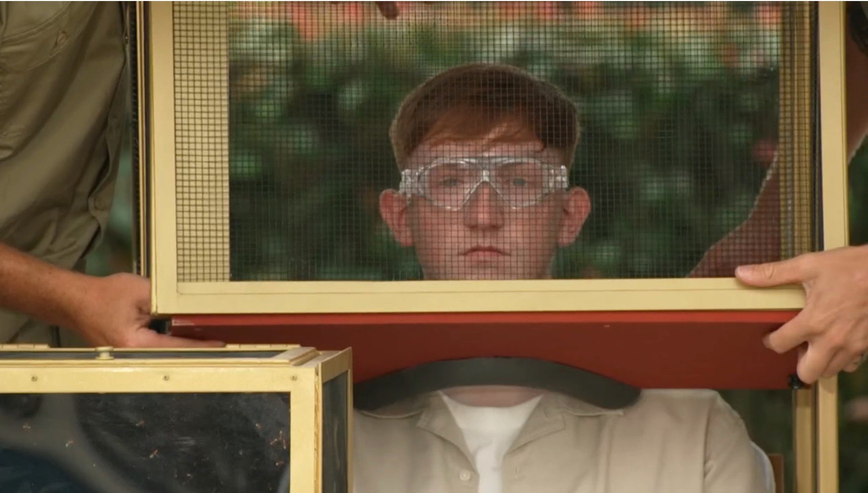 Angry Ginge with a wooden box being put over his head