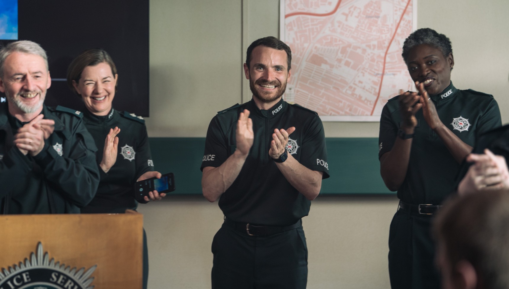 Stevie Neill and colleagues clapping in the final episode of Blue Light series 3