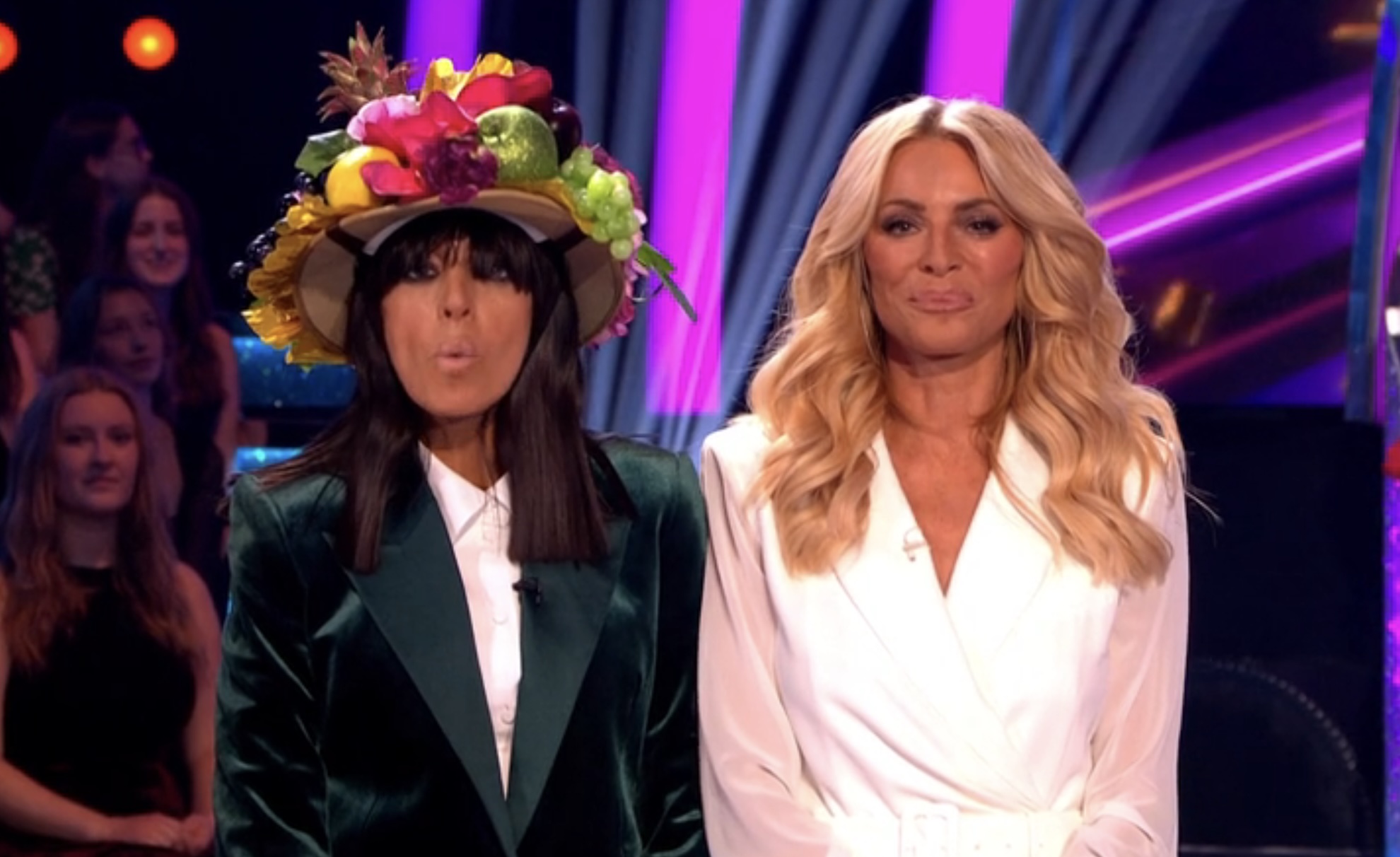 Claudia in a fruit hat while Tess tries not to laugh! 