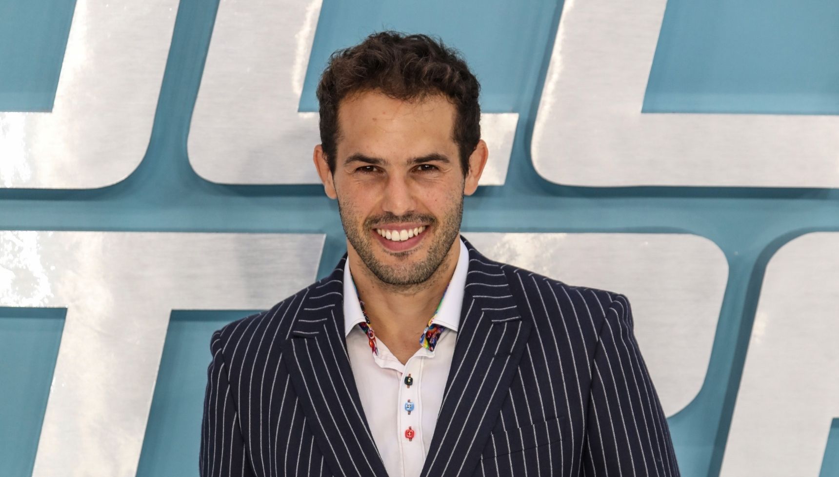 Jeremy Parisi smiling to camera