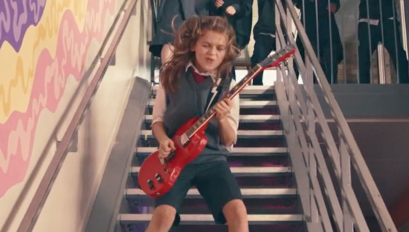 Buzz Fletcher playing a guitar