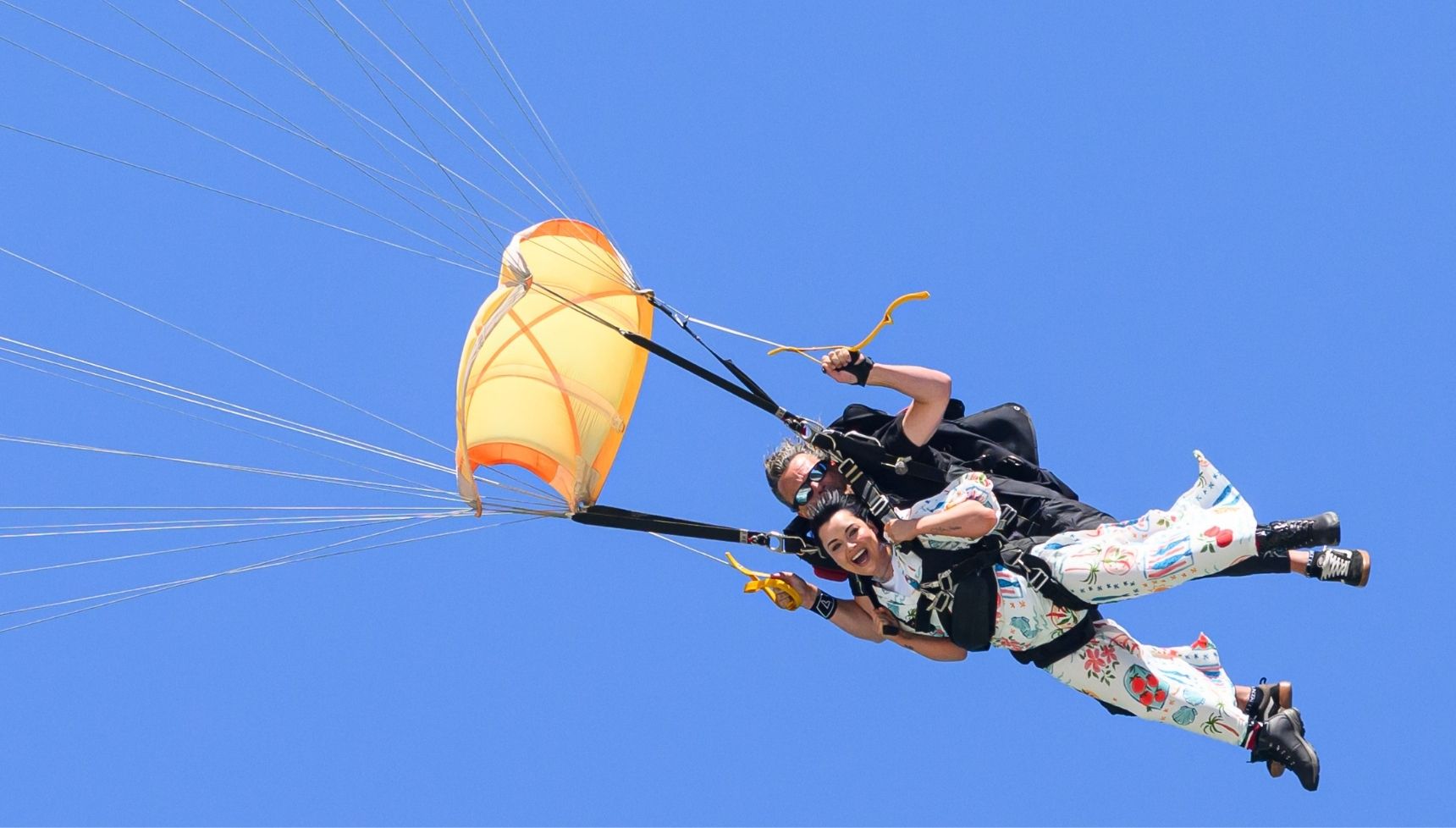 Shona McGarty parachuting into camp