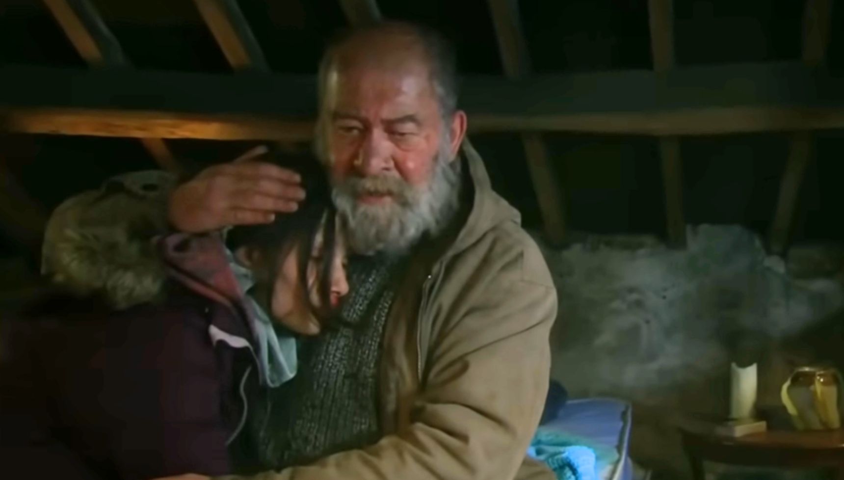 Bear holding Anya in Emmerdale