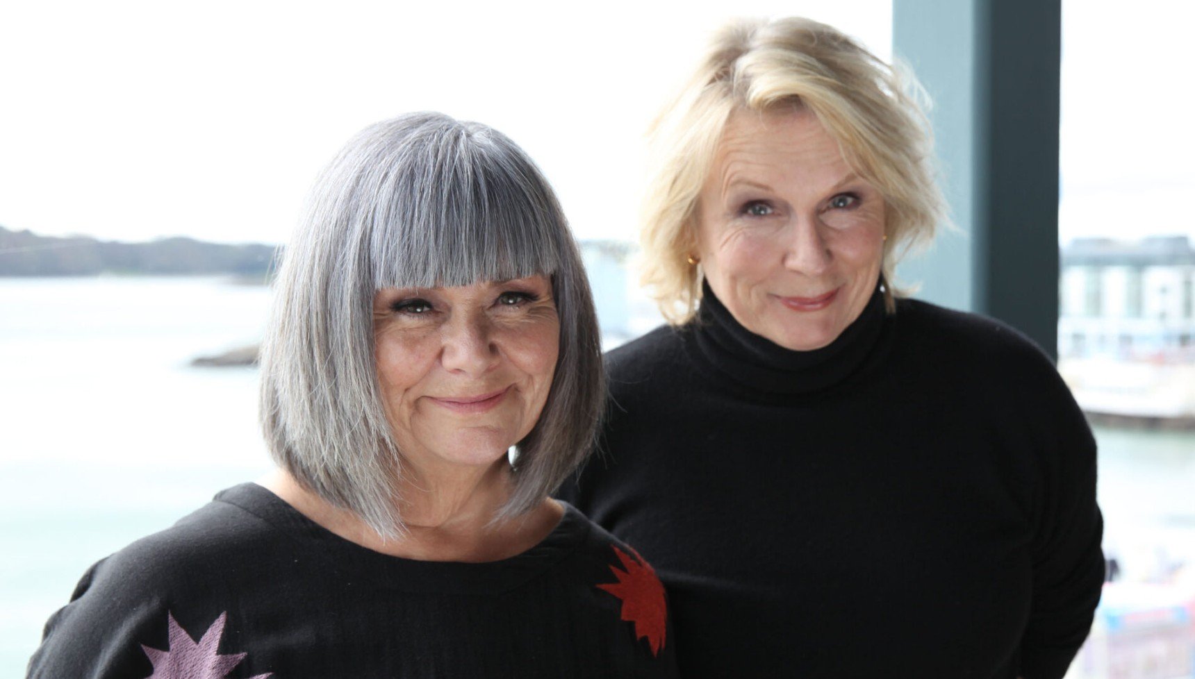 Dawn French and Jennifer Saunders smile at camera