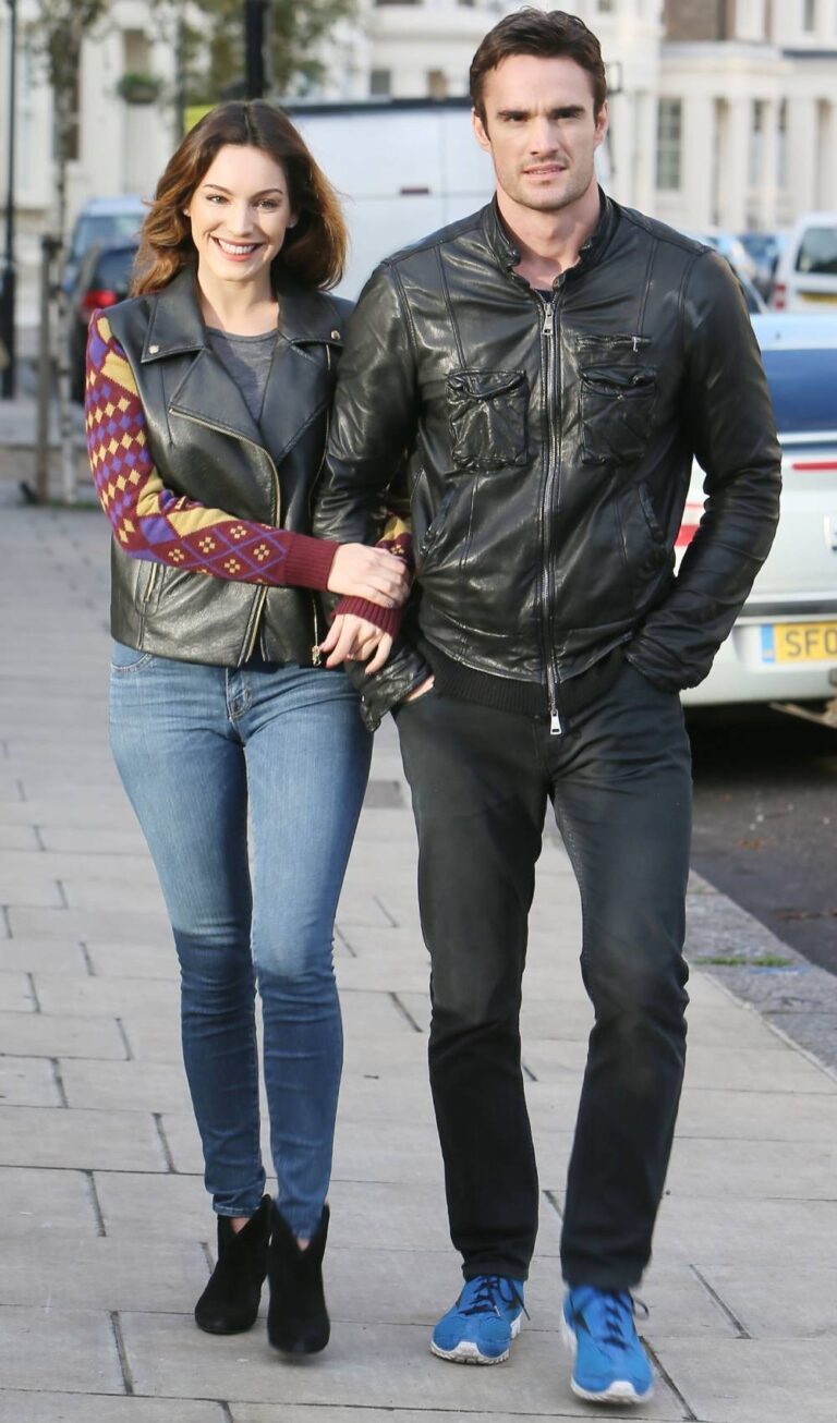 Kelly Brook walks with Thom Evans