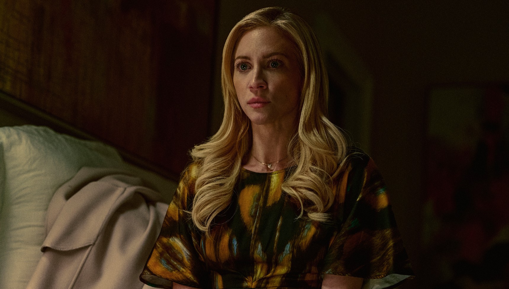 Nina sits on her bed in The Beast in Me