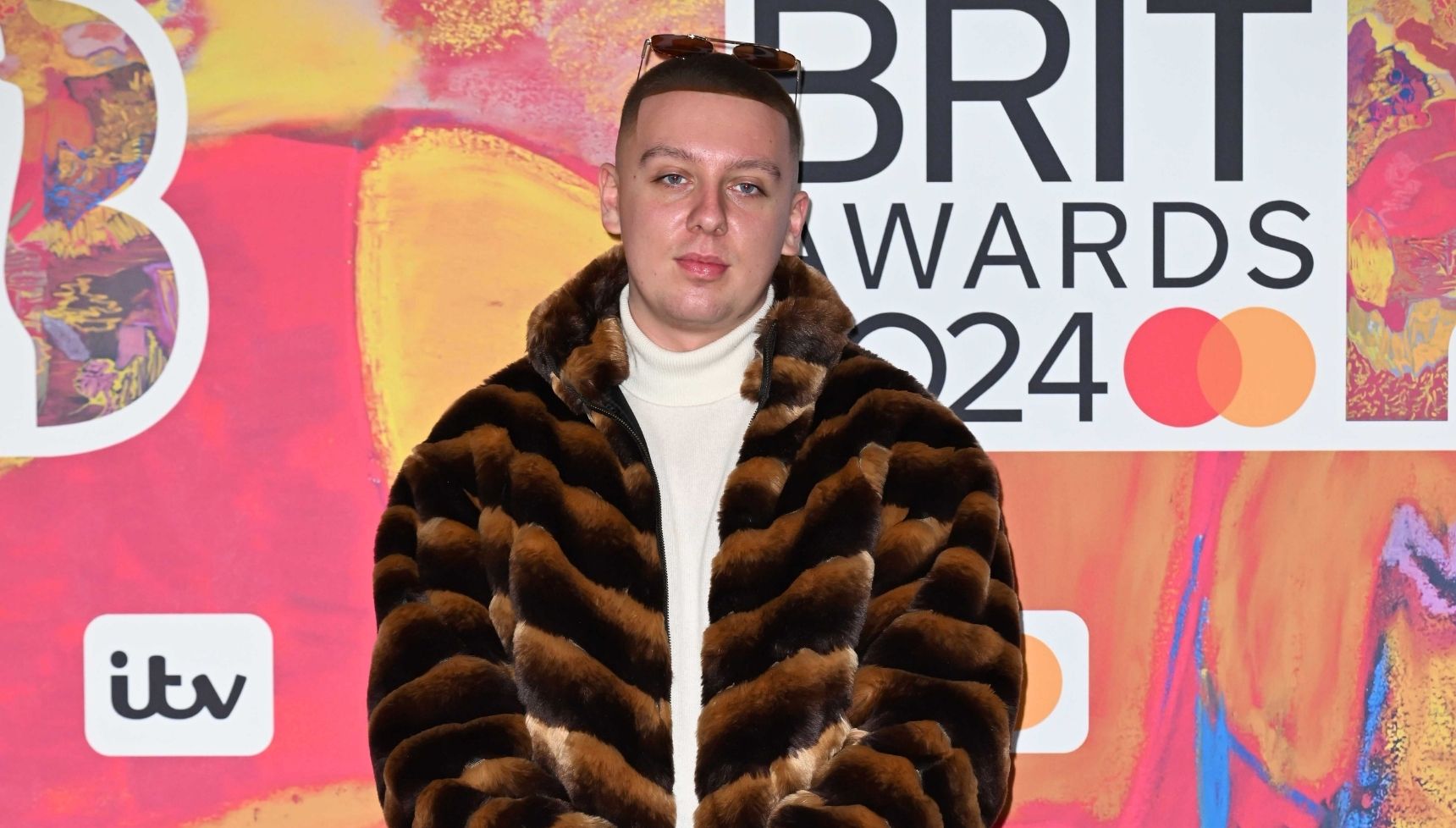 Aitch in a furry jacket at the 2024 BRIT Awards