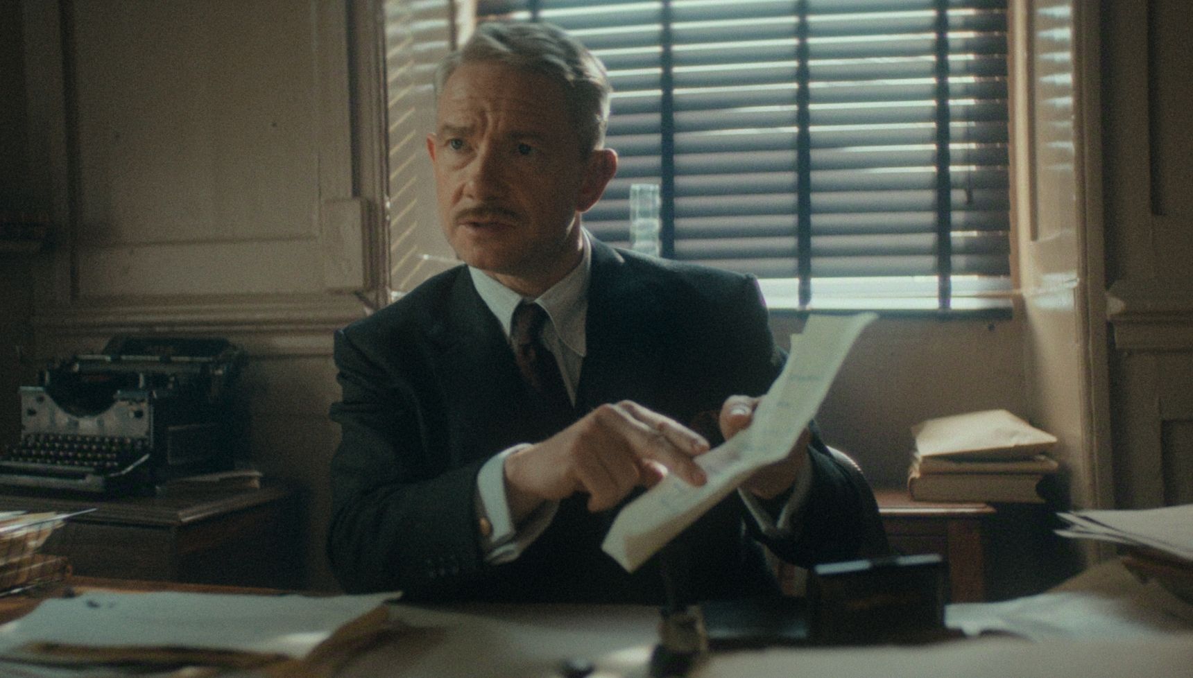 Martin Freeman wearing suit with a moustache in Agatha Christie's Seven Dials