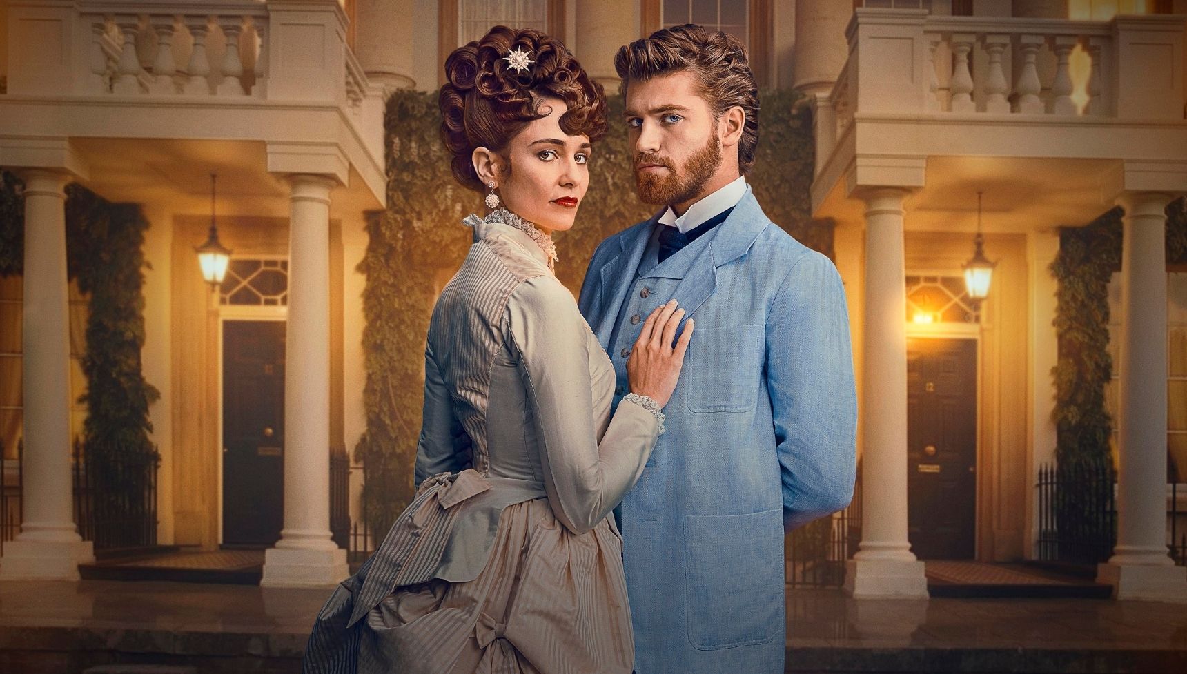 Frances and Jolyon wearing smart outfits and standing in front of a smart house in The Forsytes