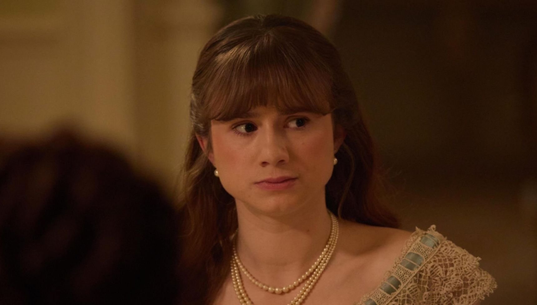 June at the dinner table looking serious