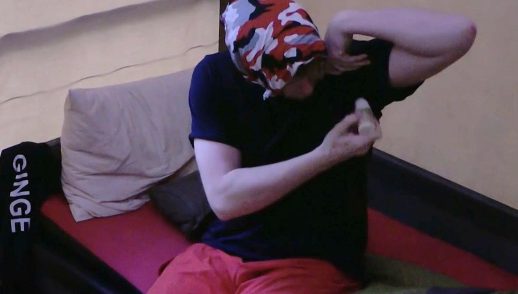 Angry Ginge putting deodorant on his t-shirt