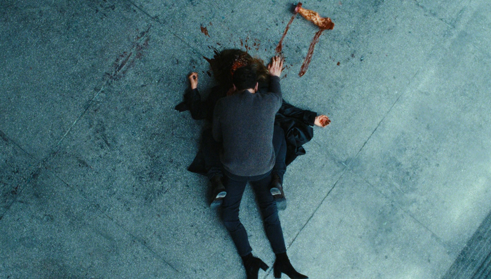 Nile lies over Madison's dead body in The Beast in Me