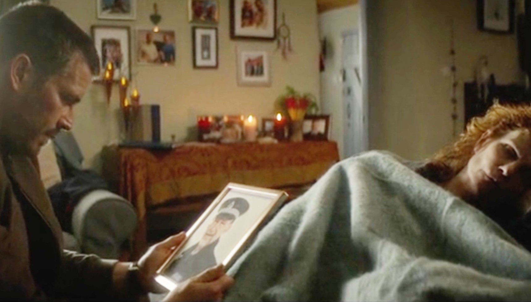 Ben Cooper looking at a picture if his dad in Cooper & Fry