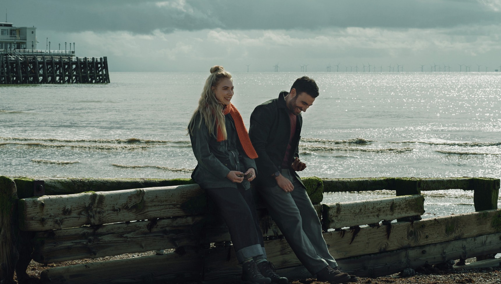 Imogen Poots and Brett Goldstein laughing on a beach