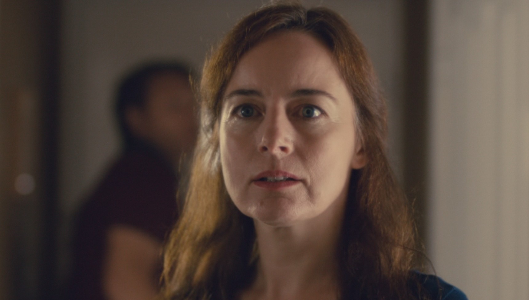 Amanda Drew standing in front of Shaun Dooley in Broadchurch series 2