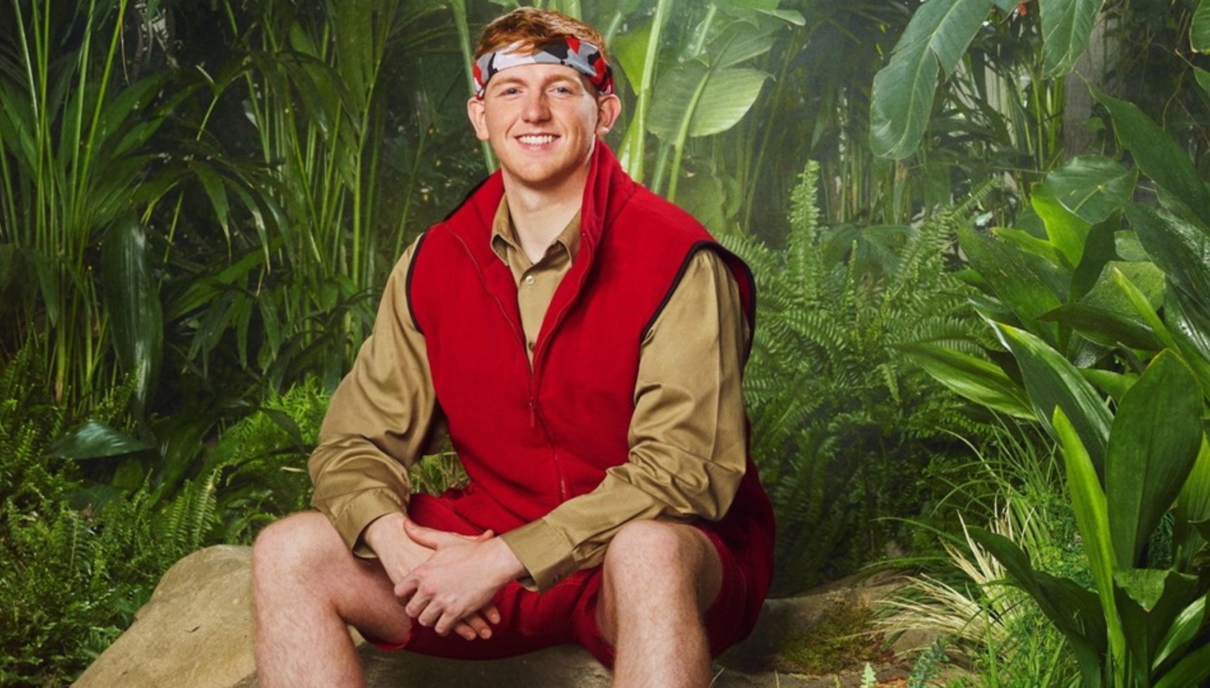 Angry Ginge sitting on a rock in the jungle in I'm A Celebrity Get Me Out of Here 2025