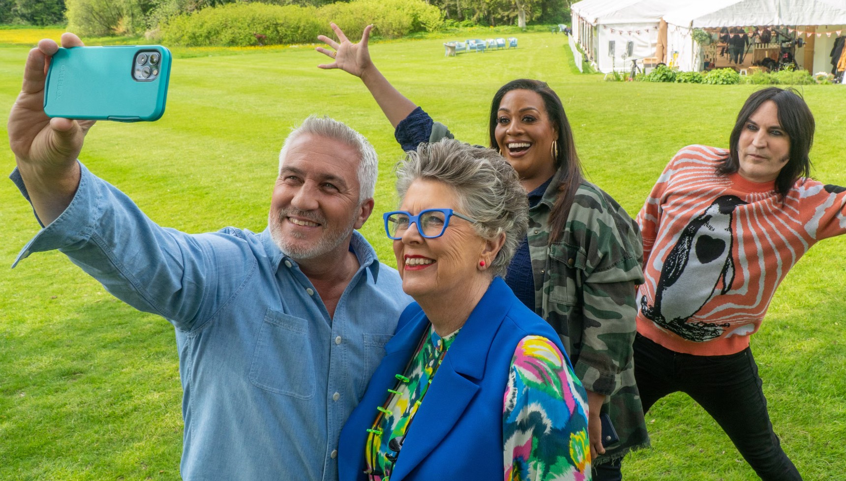 Paul Hollywood taking a selfie with Prue Leith as Alison Hammon and Noel Fielding pose in the background