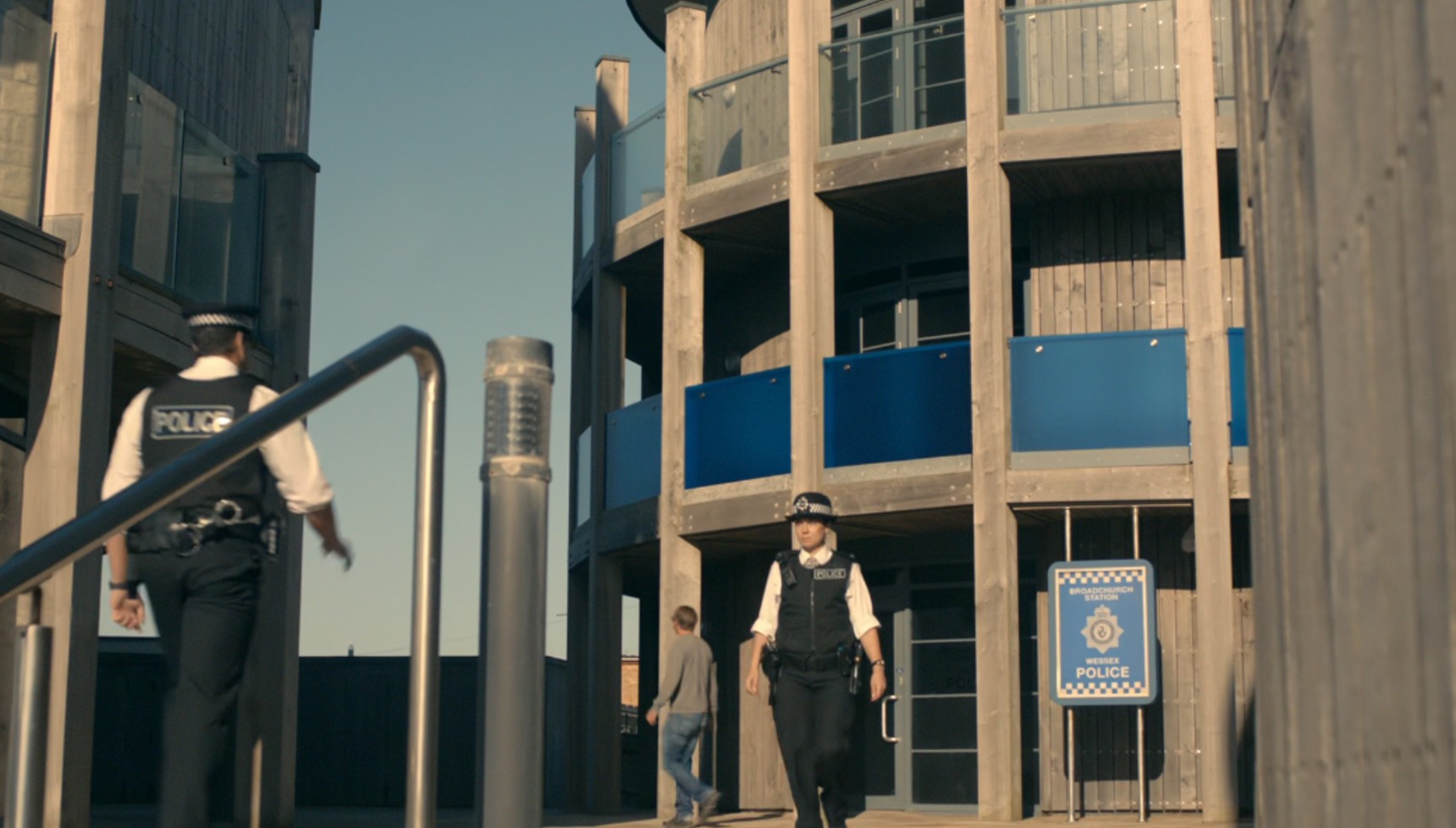 Two police officers walking outside Wessex Police Station in Broadchurch 