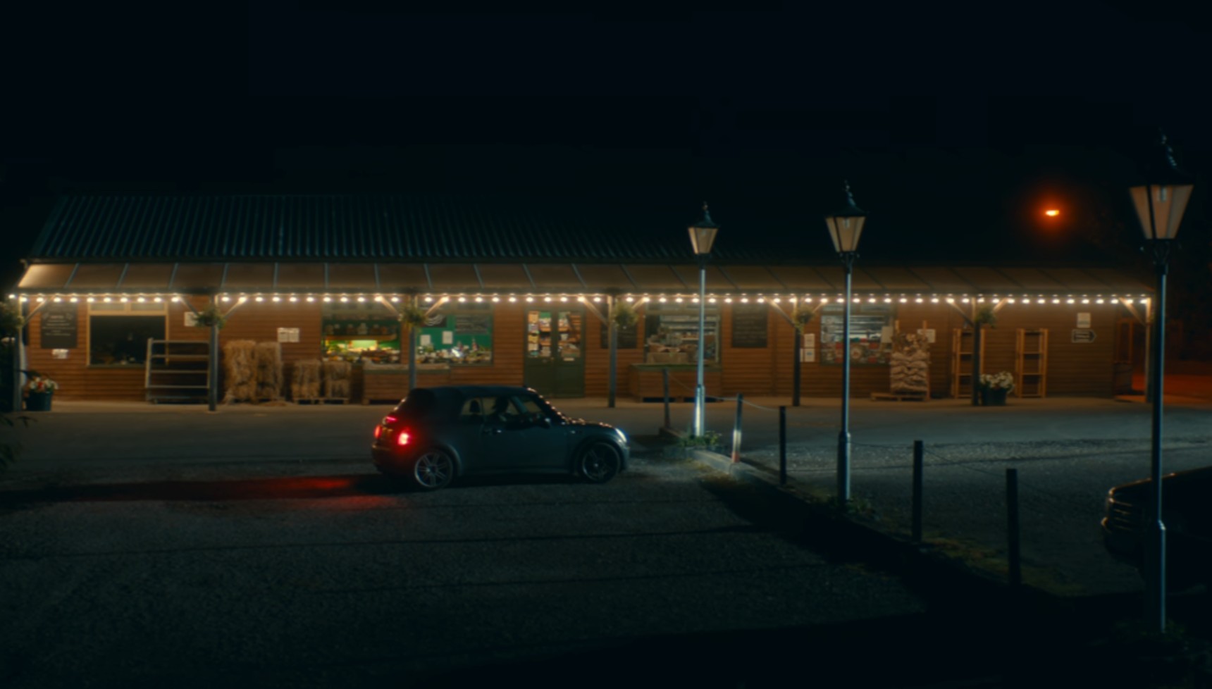 The outside of a farm shop at night in Broadchurch series 3