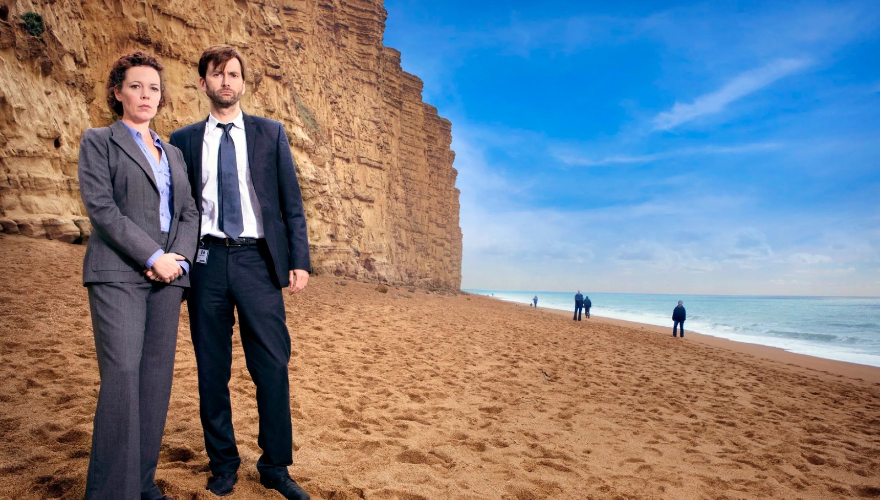Olivia Colman and David Tennant standing on the beach in Broadchurch