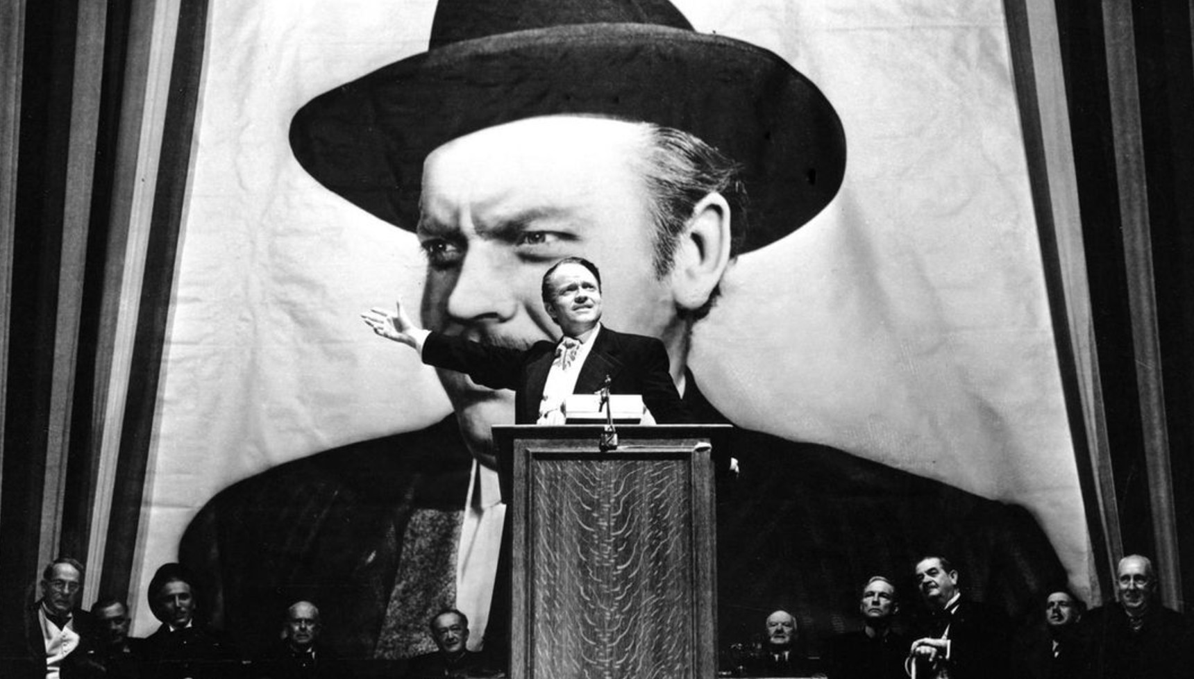 Orson Welles standing in front of his own portrait in Citizen Kane