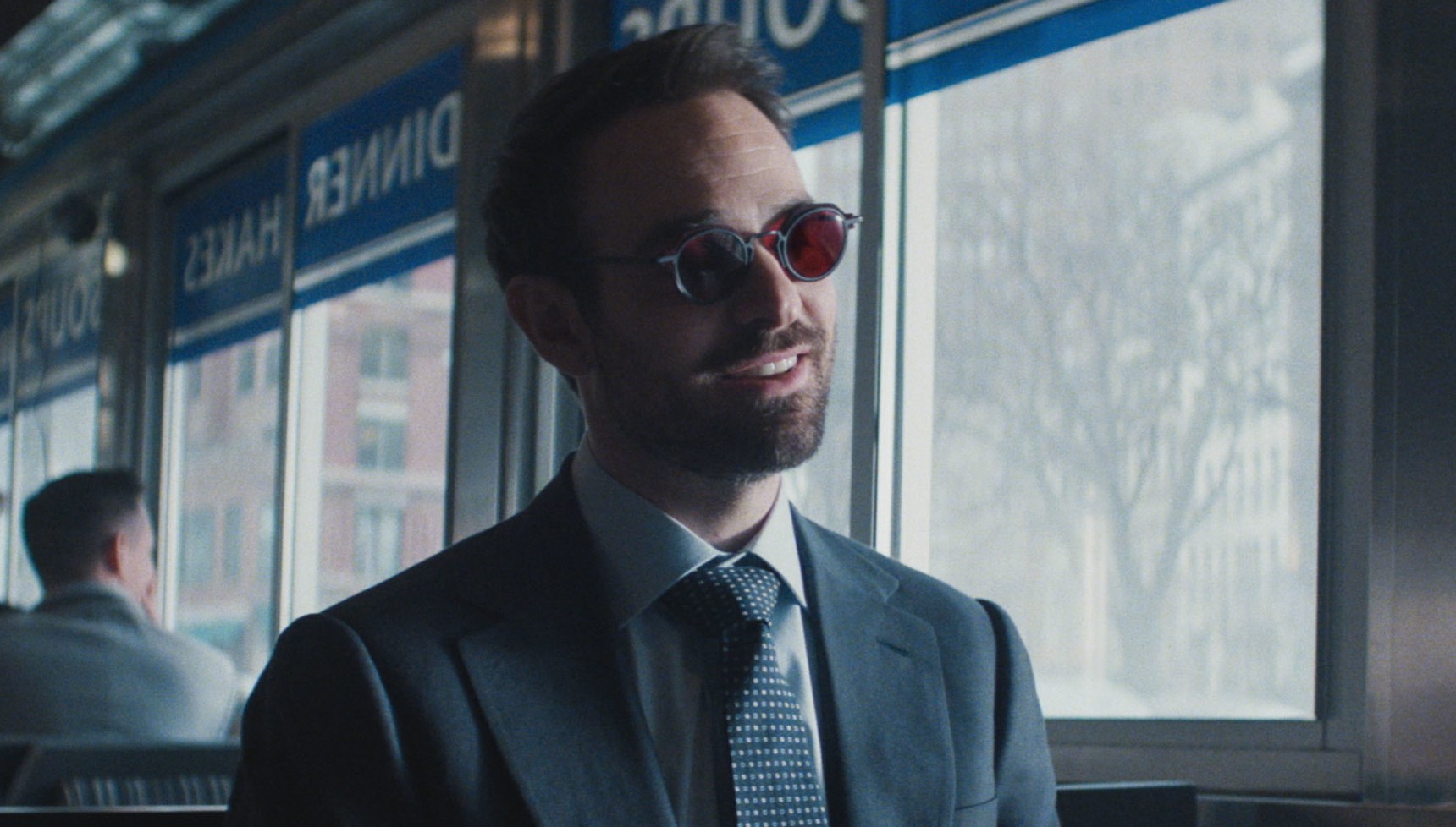 Charlie Cox's Daredevil sits in a diner in Daredevil: Born Again