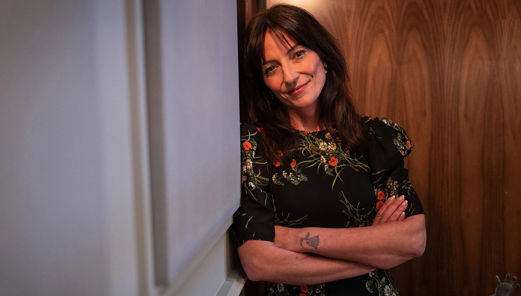 Davina McCall leaning against a wall in Doctor Who