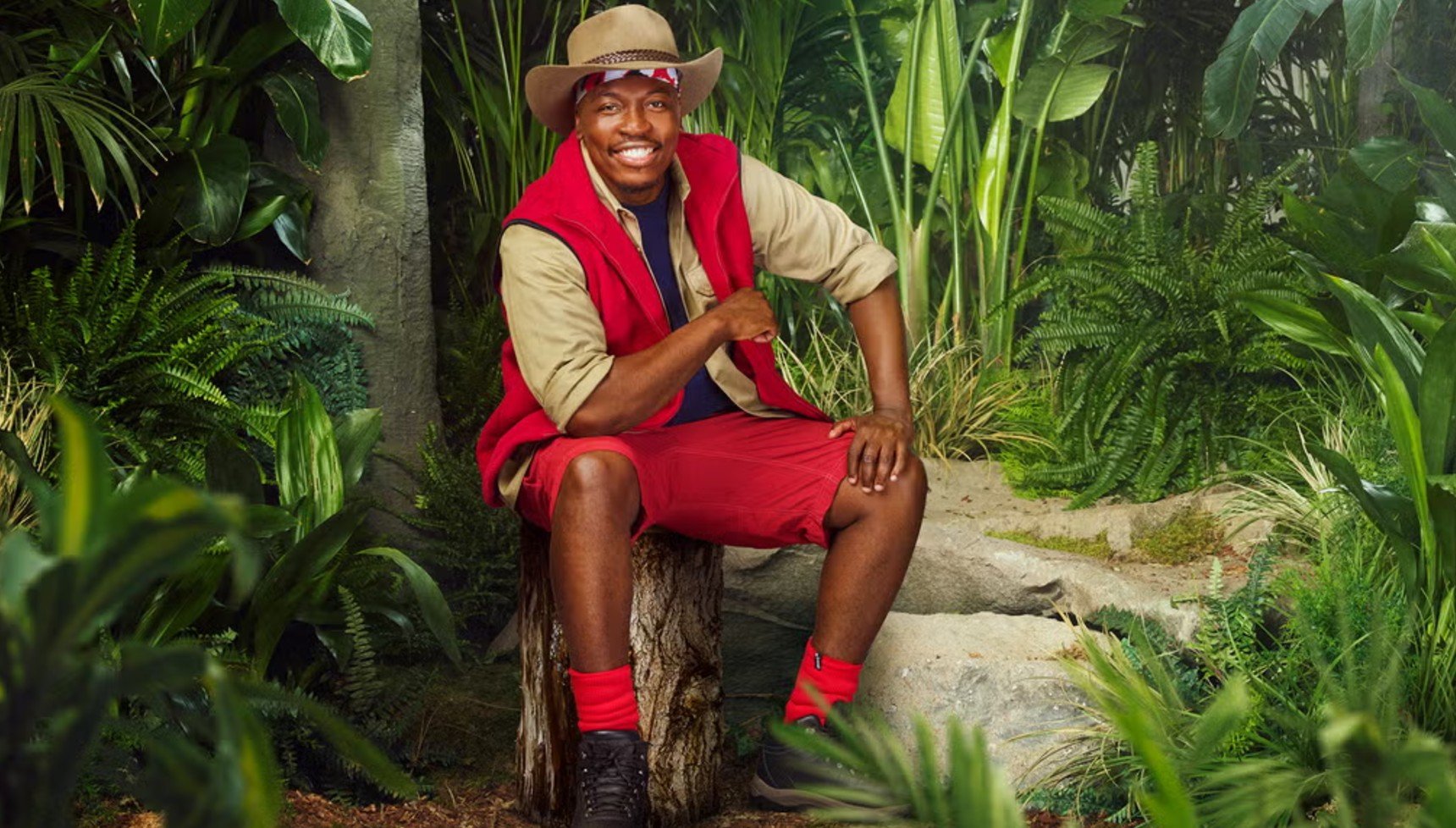 Eddie Kadi wearing red socks in I'm a Celebrity