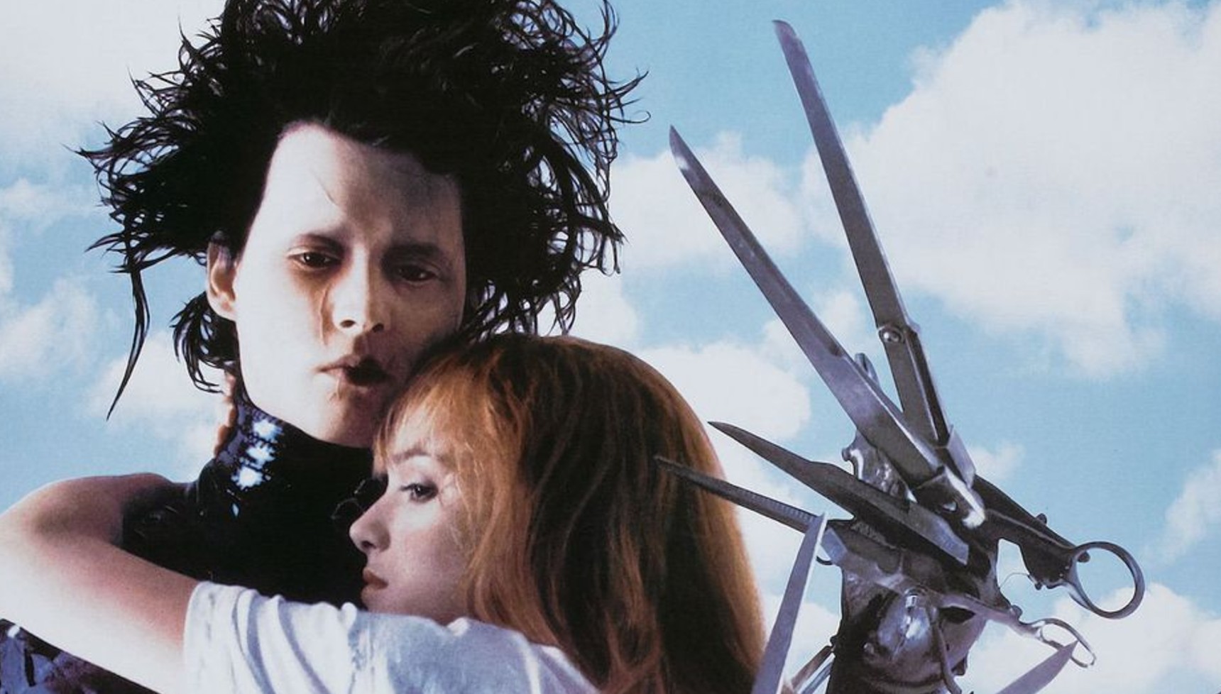 Johnny Depp as Edward Scissorhands and Winona Ryder hugging him