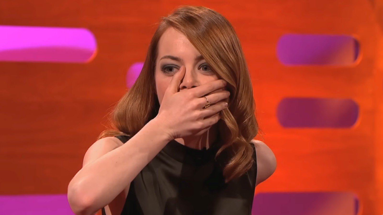 Emma Stone with her hand over her mouth on The Graham Norton Show
