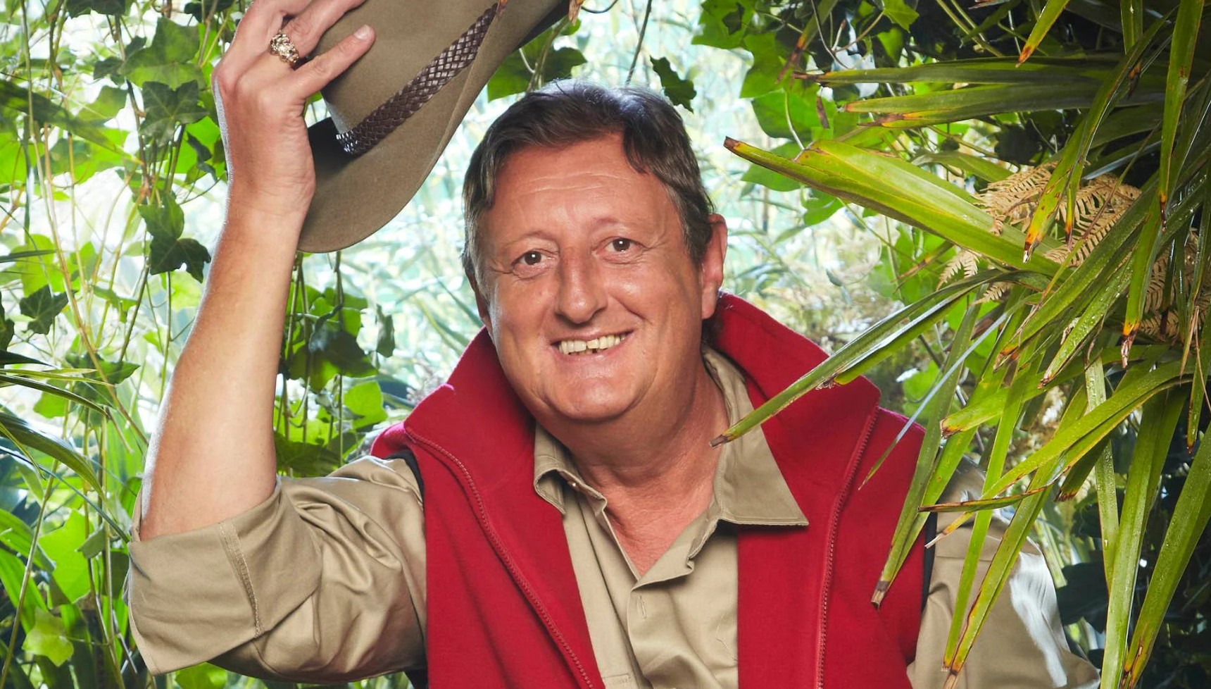 Eric Bristow smiling and lifting his hat in I'm A Celebrity 2025