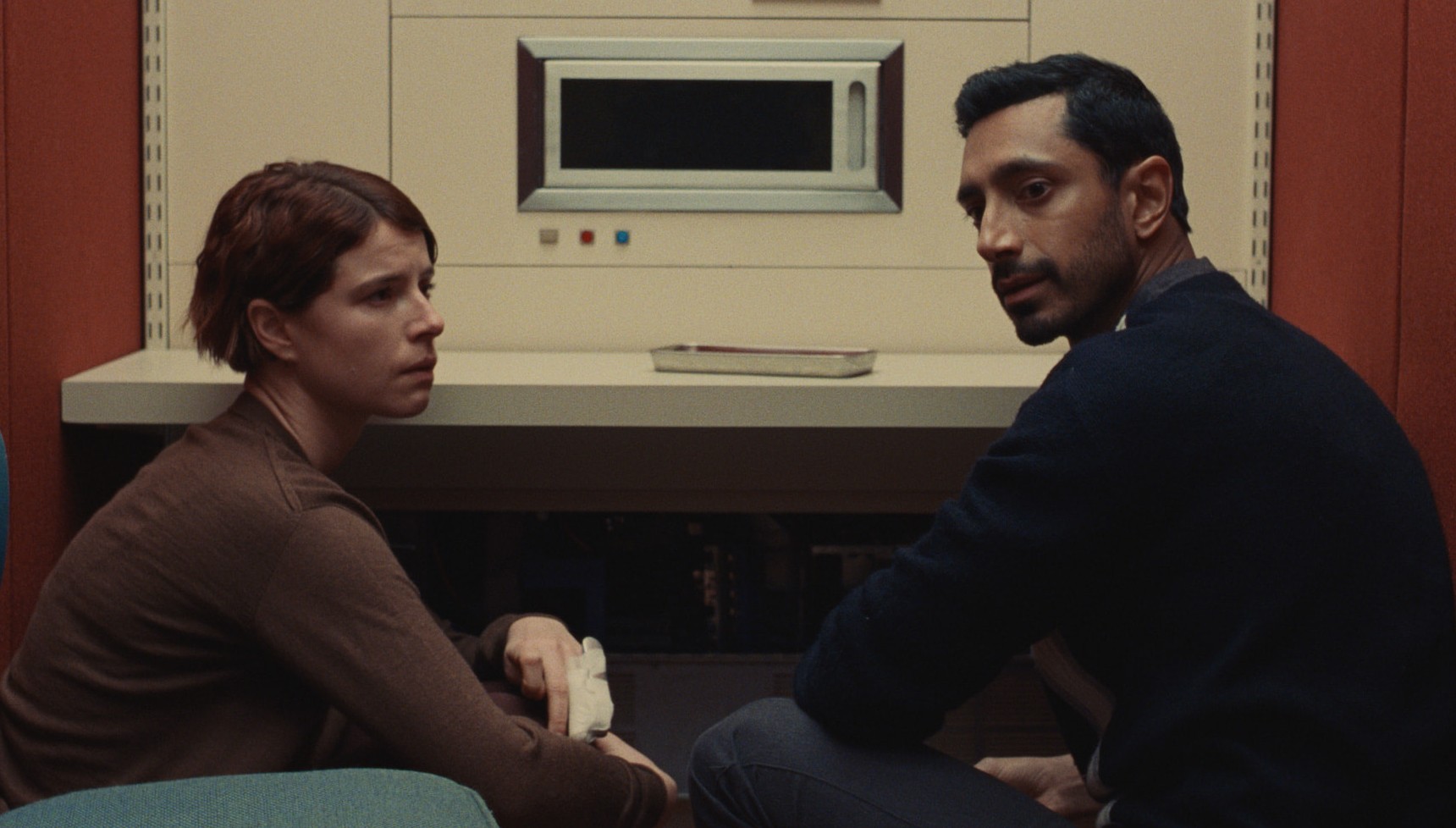 Jessie Buckley and Riz Ahmed's characters await a machine's results