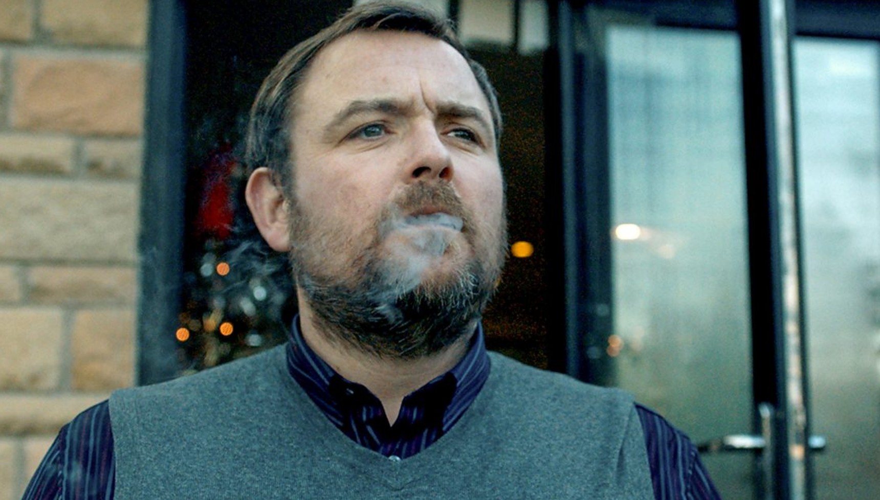 Neil Maskell with smoke coming out of his mouth in Happy New Year Colin Burstead 
