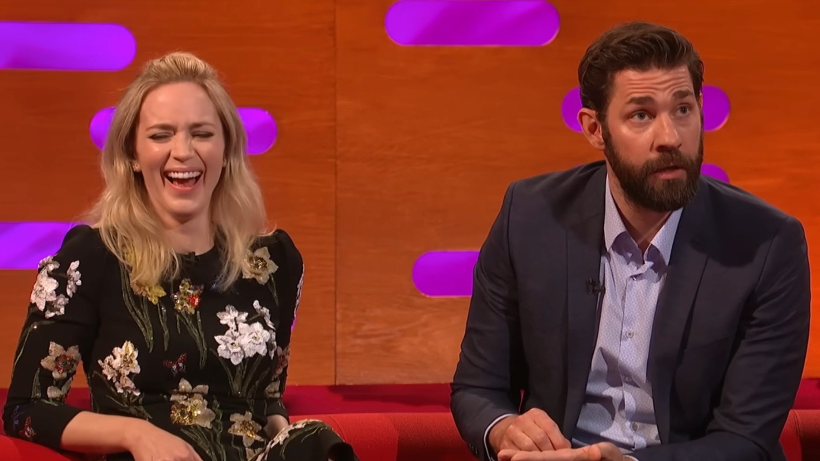 Emily Blunt laughing as John Krasinski tells a story on The Graham Norton Show