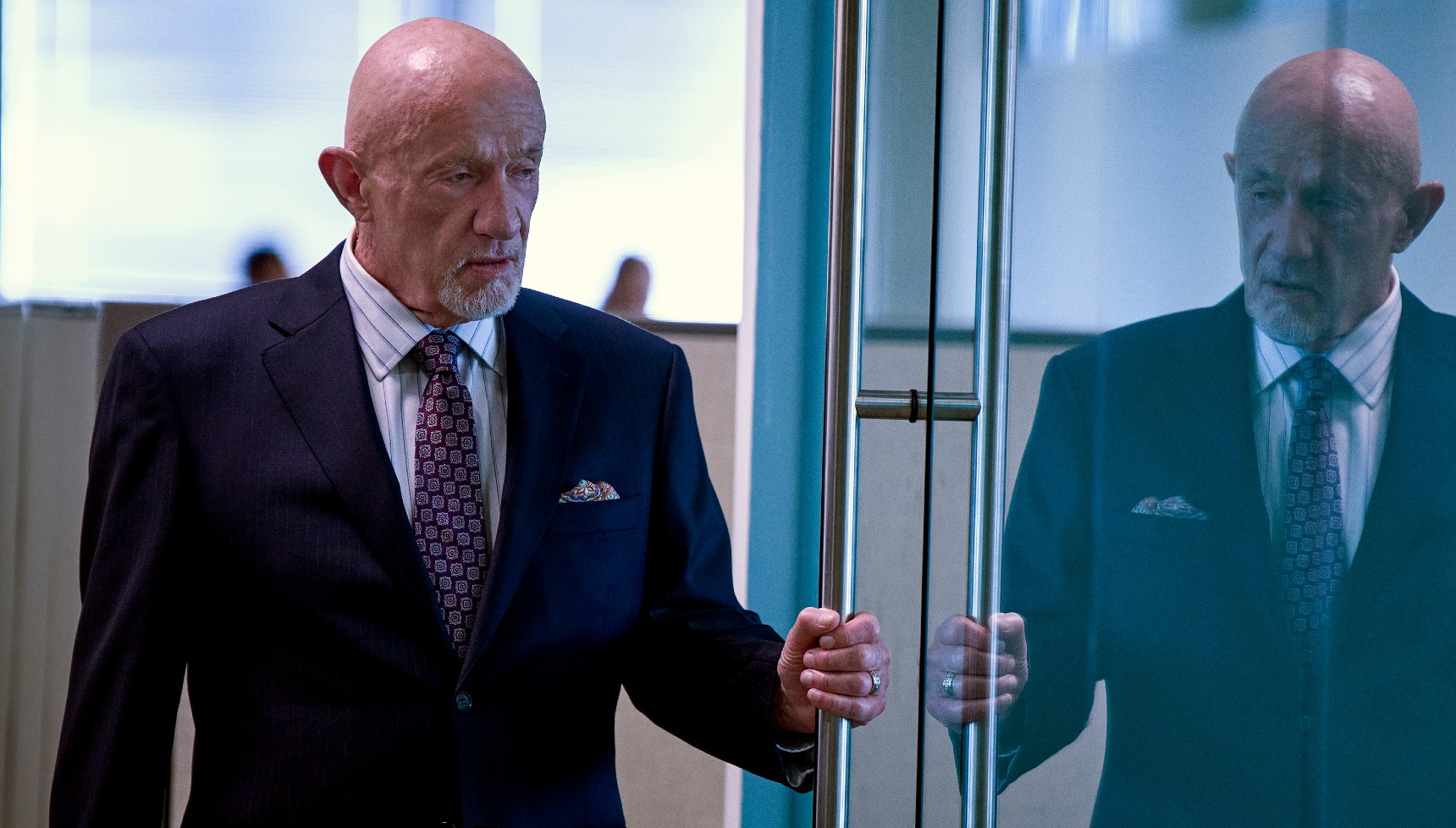 Jonathan Banks opening a door in The Beast in Me