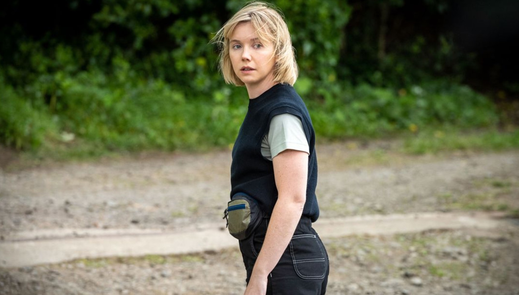 Lauren Lyle standing on a beach in Karen Pirie