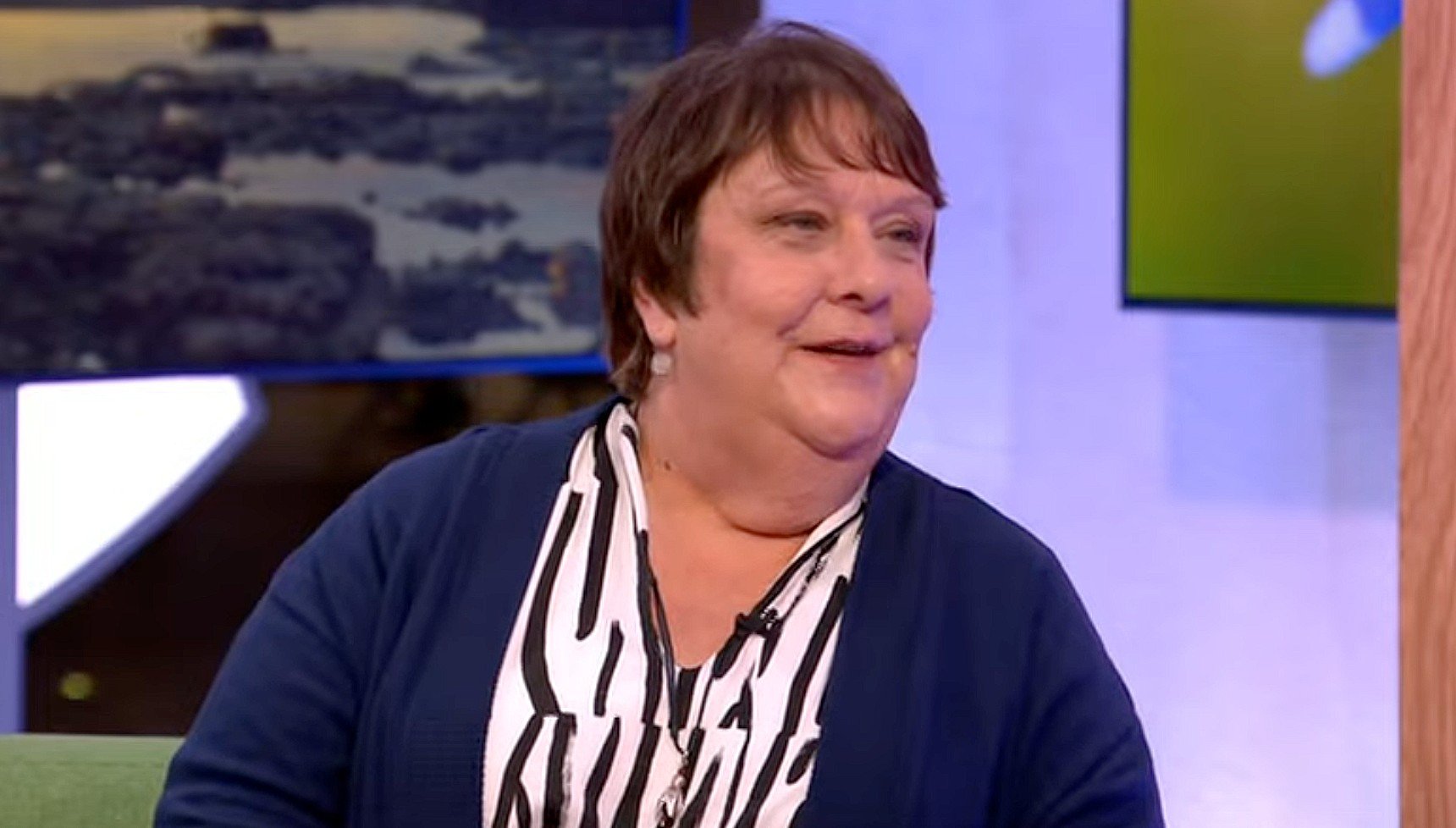 Kathy Burke wearing a blue cardigan on The One Show