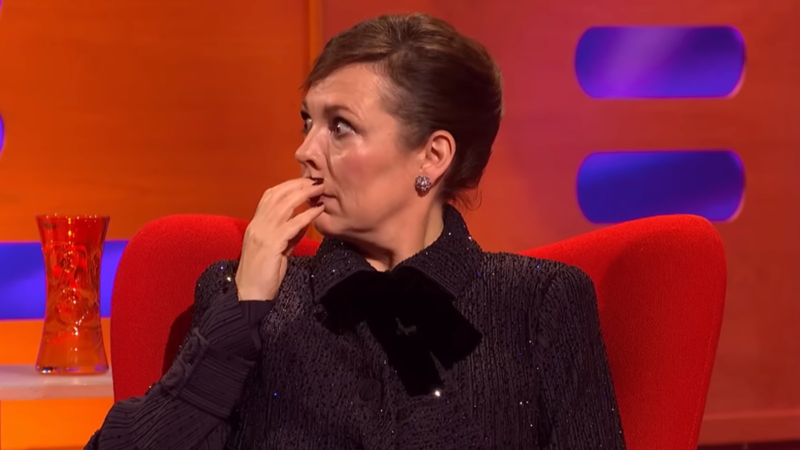Olivia Colman with a shocked, embarrassed expression on The Graham Norton Show