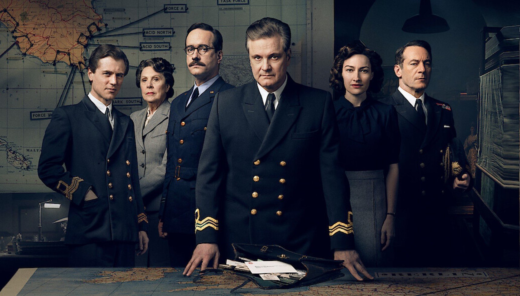 The cast of Operation Mincemeat in front of a map