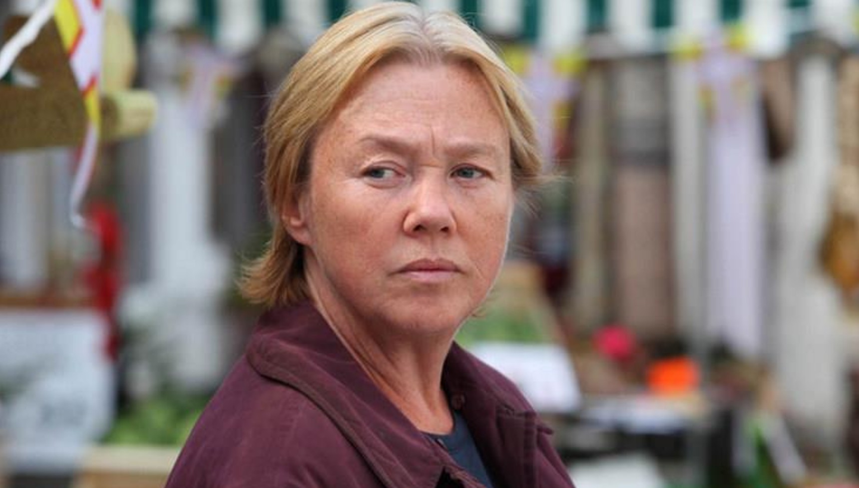 Pauline Quirke wearing a burgundy hoodie in Broadchurch