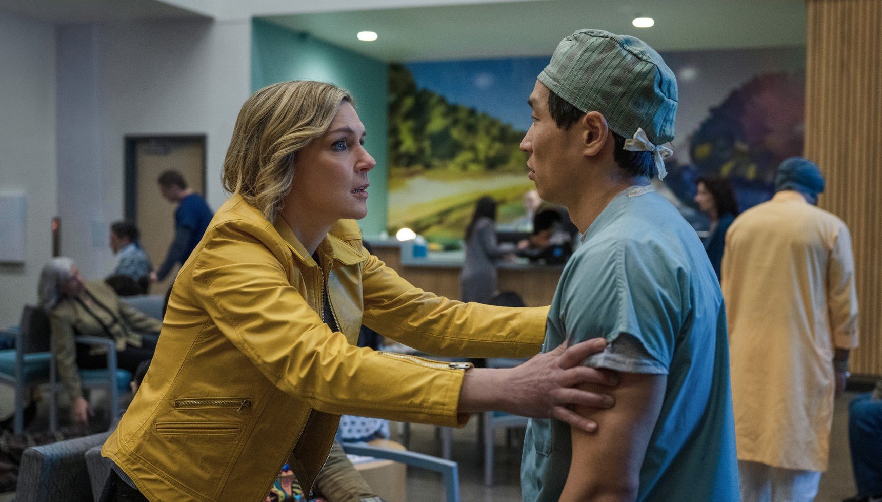 Woman frantically grabbing a doctor in Pluribus