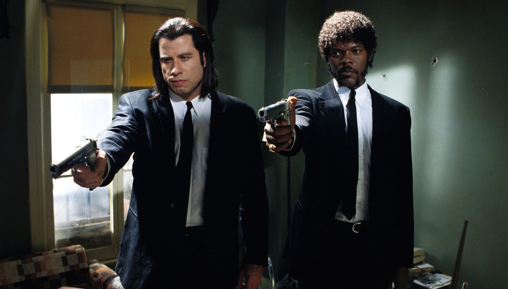 John Travolta and Samuel L. Jackson pointing guns in Pulp Fiction