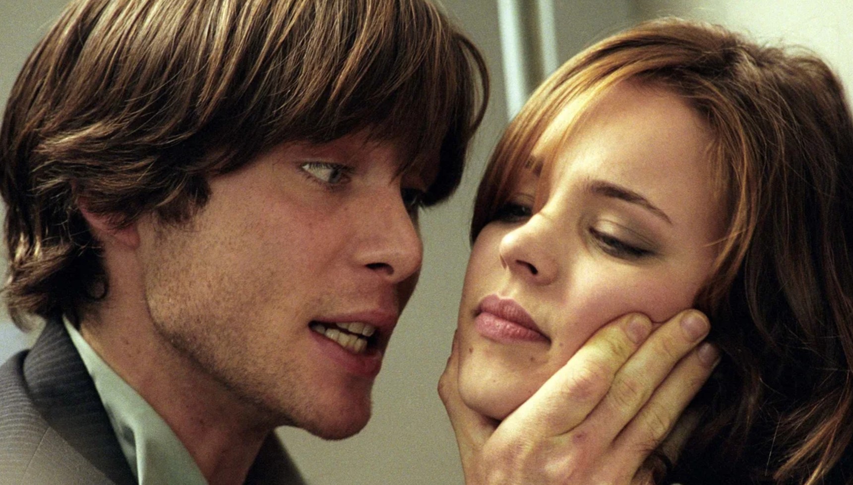 Cillian Murphy with his hand on Rachel McAdams' face in Red Eye