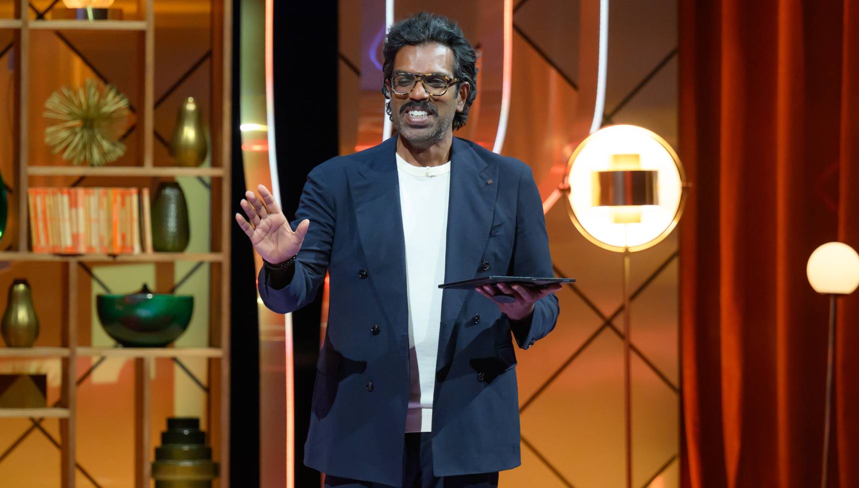 Romesh Ranganathan smiling on Romesh Ranganathan's Parents' Evening heading to ITV at Christmas