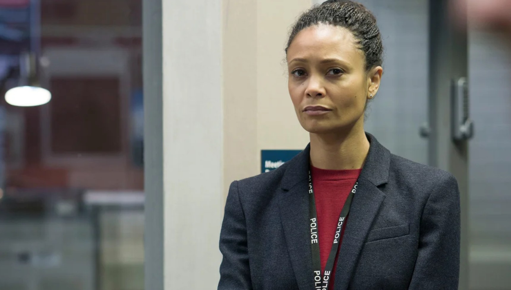 Thandiwe Newton in a grey suit and red shirt in Line of Duty series 4