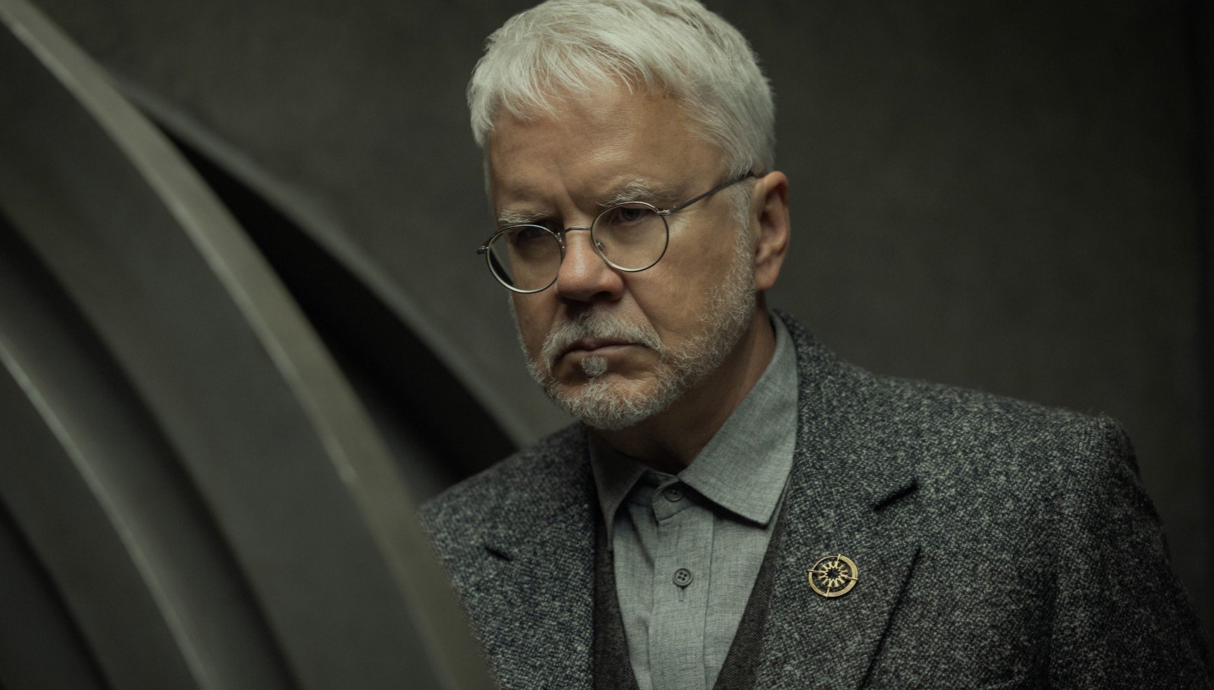Man in a grey suit in Silo