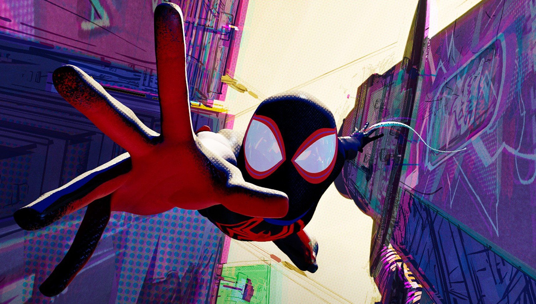 Miles Morales reaching out as he swings from a web in Spider-Man: Across the Spider-Verse
