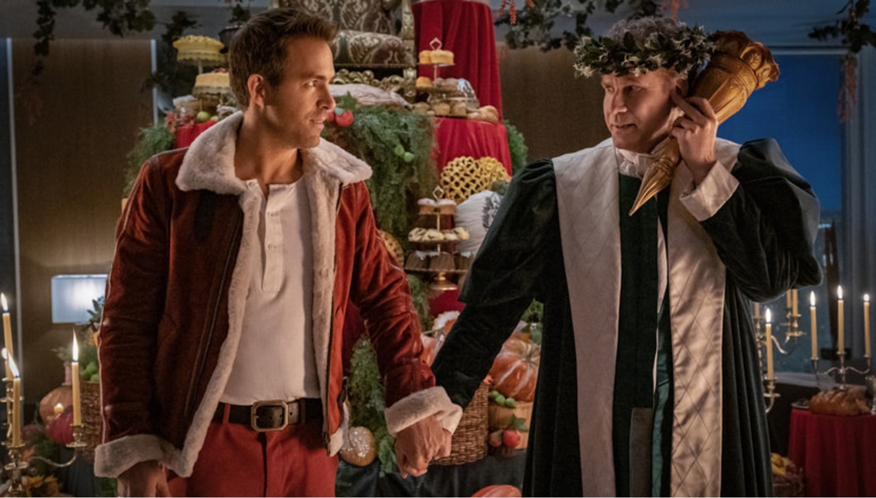 Ryan Reynolds and Will Ferrell dressed up in Santa and priestly clothes