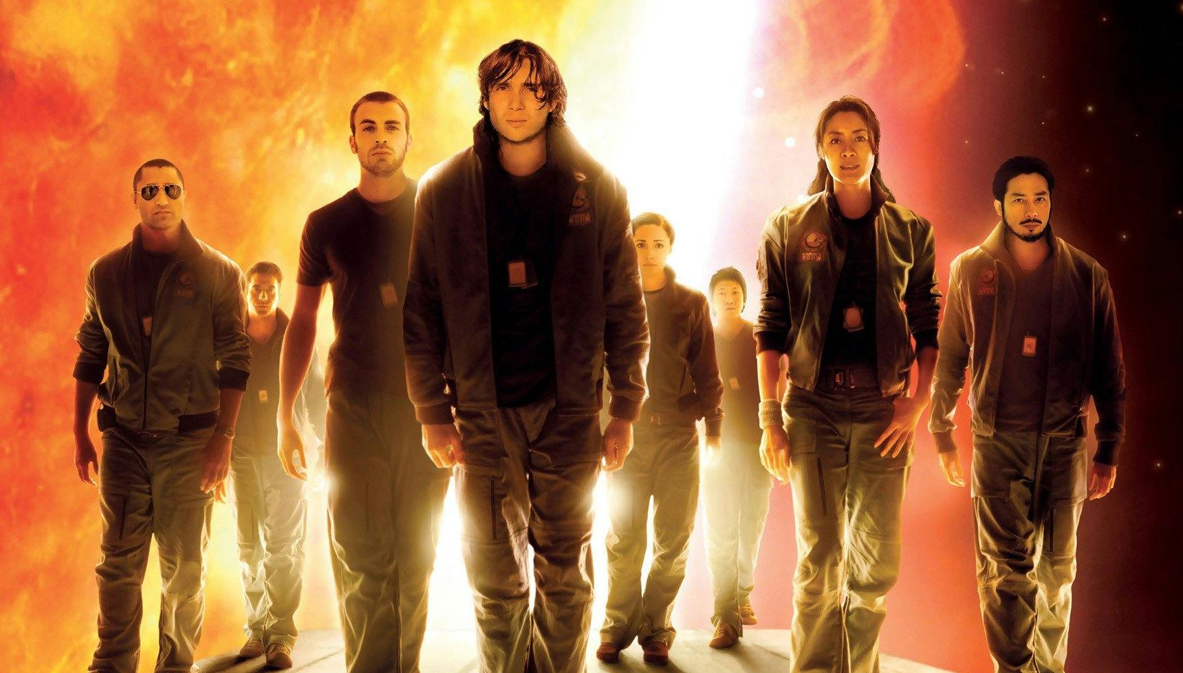 The cast of Sunshine posing on the poster in front of the sun